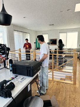Camera cases on the kitchen island as the crew sets up